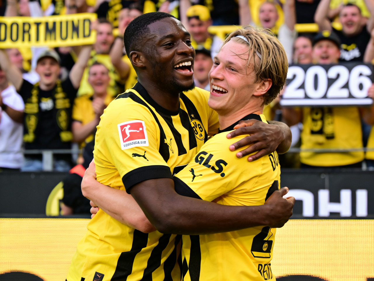 Guirassy and Beier celebrating together in Dortmund kits